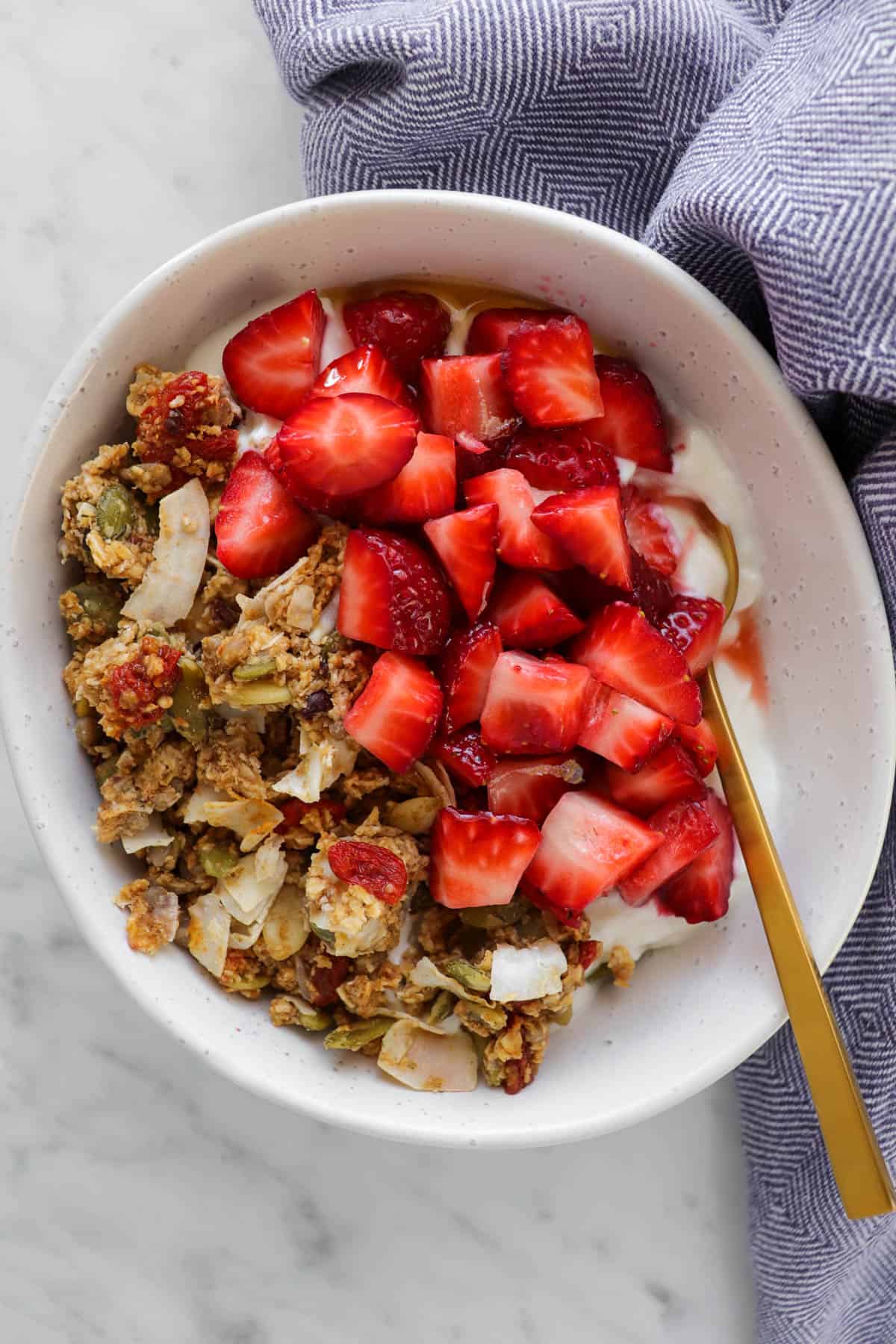 Yoghurt bowl with strawberries and granola.