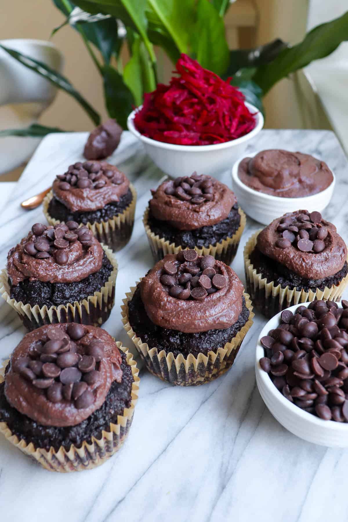 Chocolate muffins with chocolate frosting on top.