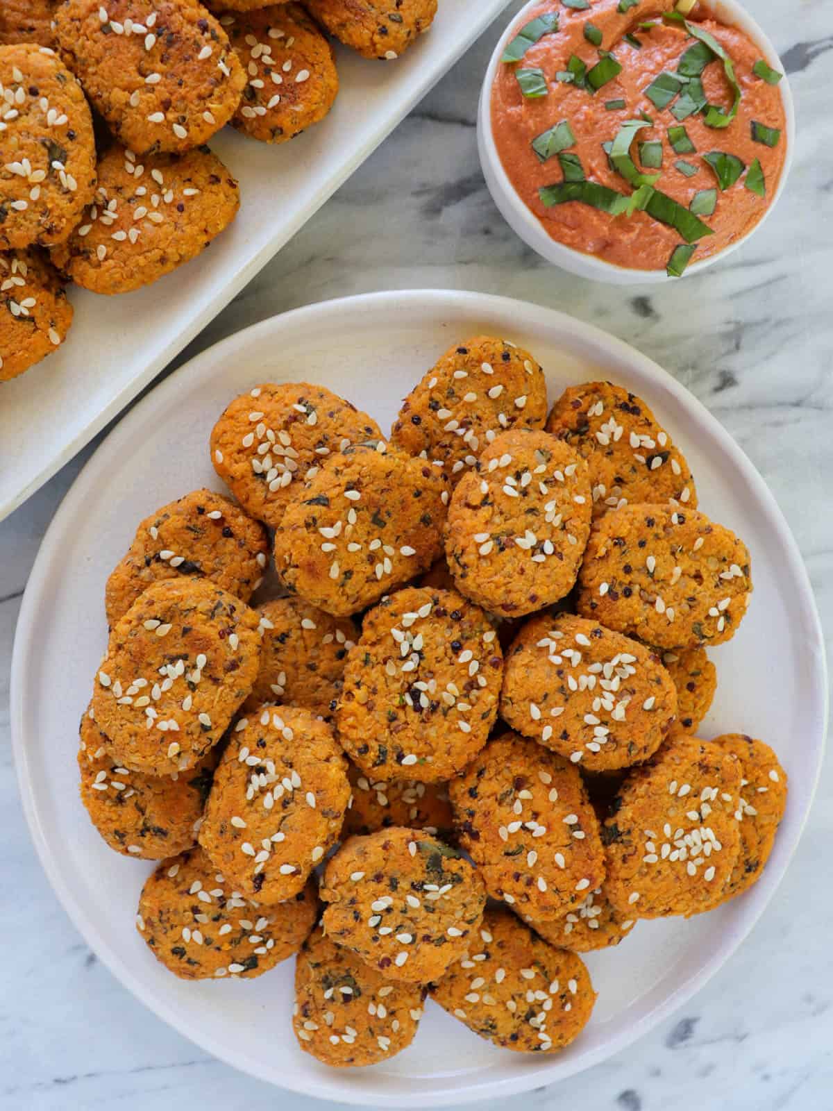 Sweet potato bites on a mini plate with creamy tomato dip on the side.
