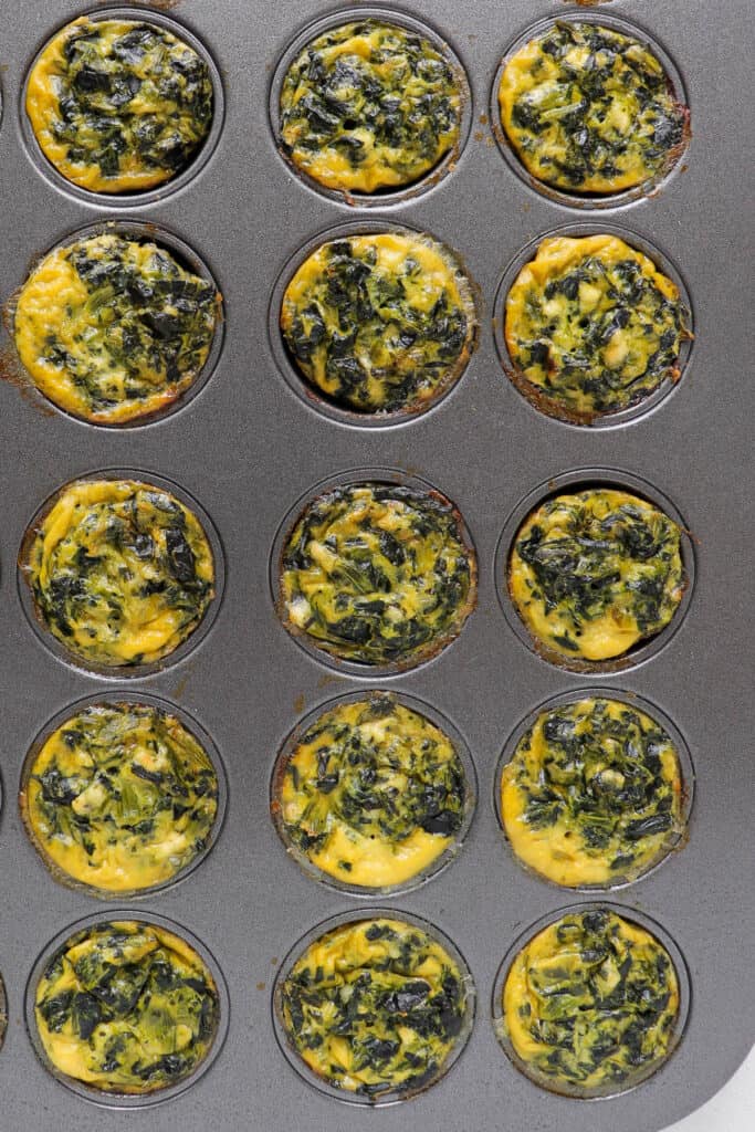 Baked quiches in muffin tin.