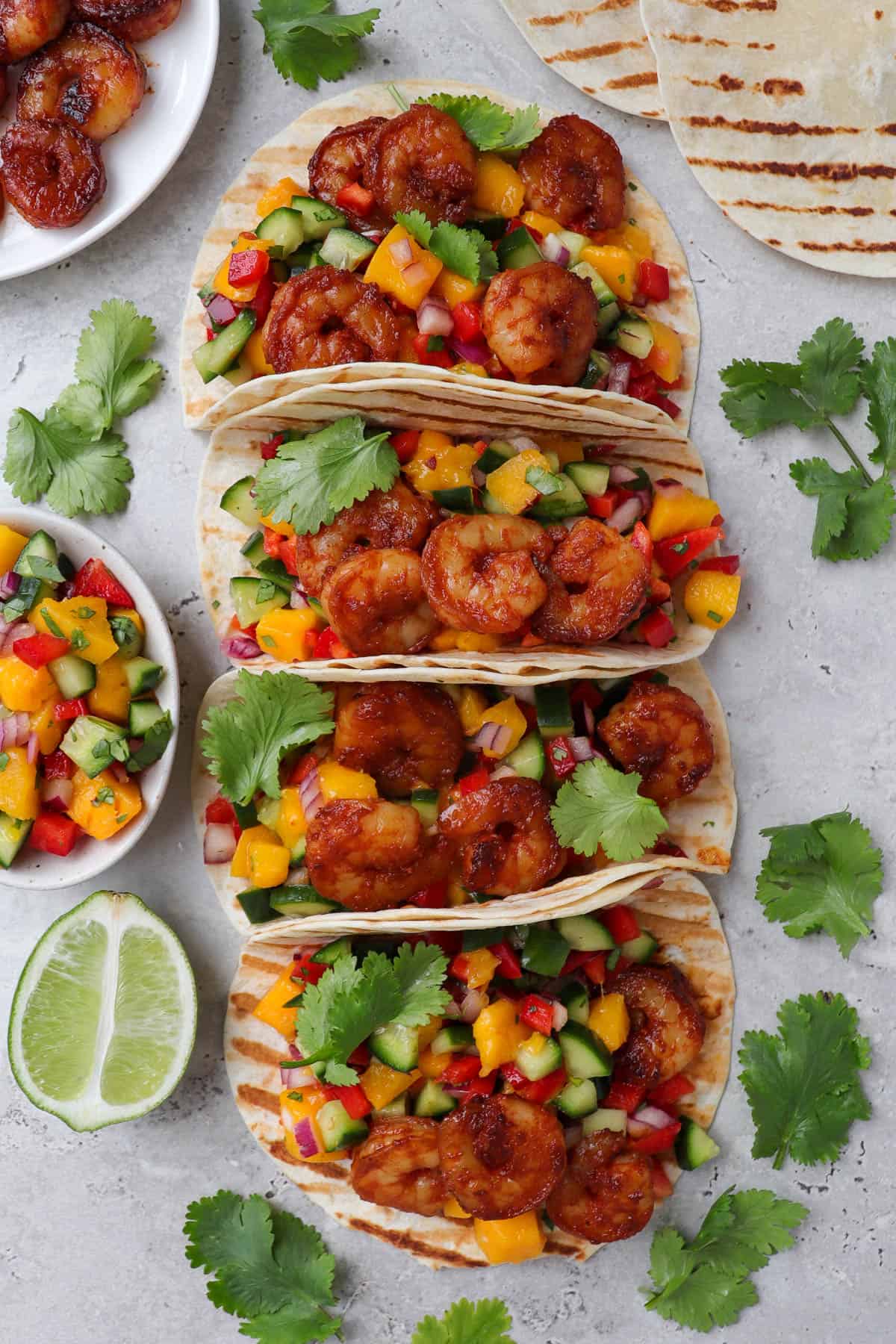 Tacos placed in a straight row.