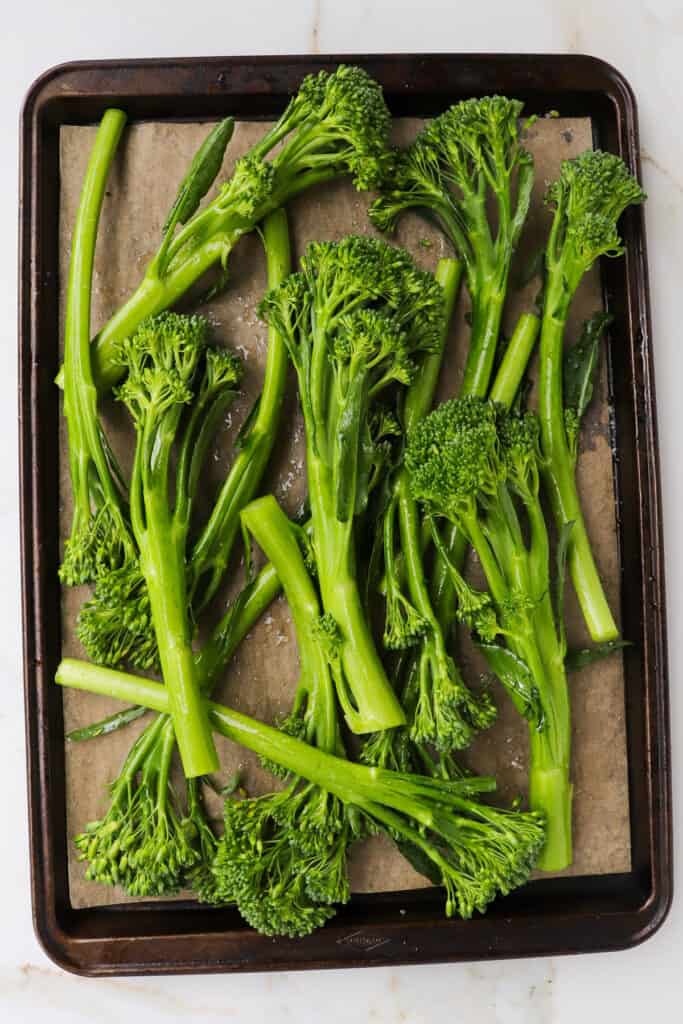 Broccolini on baking tray.