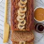 Easy 5 ingredient vegan banana bread made with almond butter and spelt flour. Naturally sweetened and oil-free, it's the perfect treat to have on hand for a quick breakfast or healthy snack.