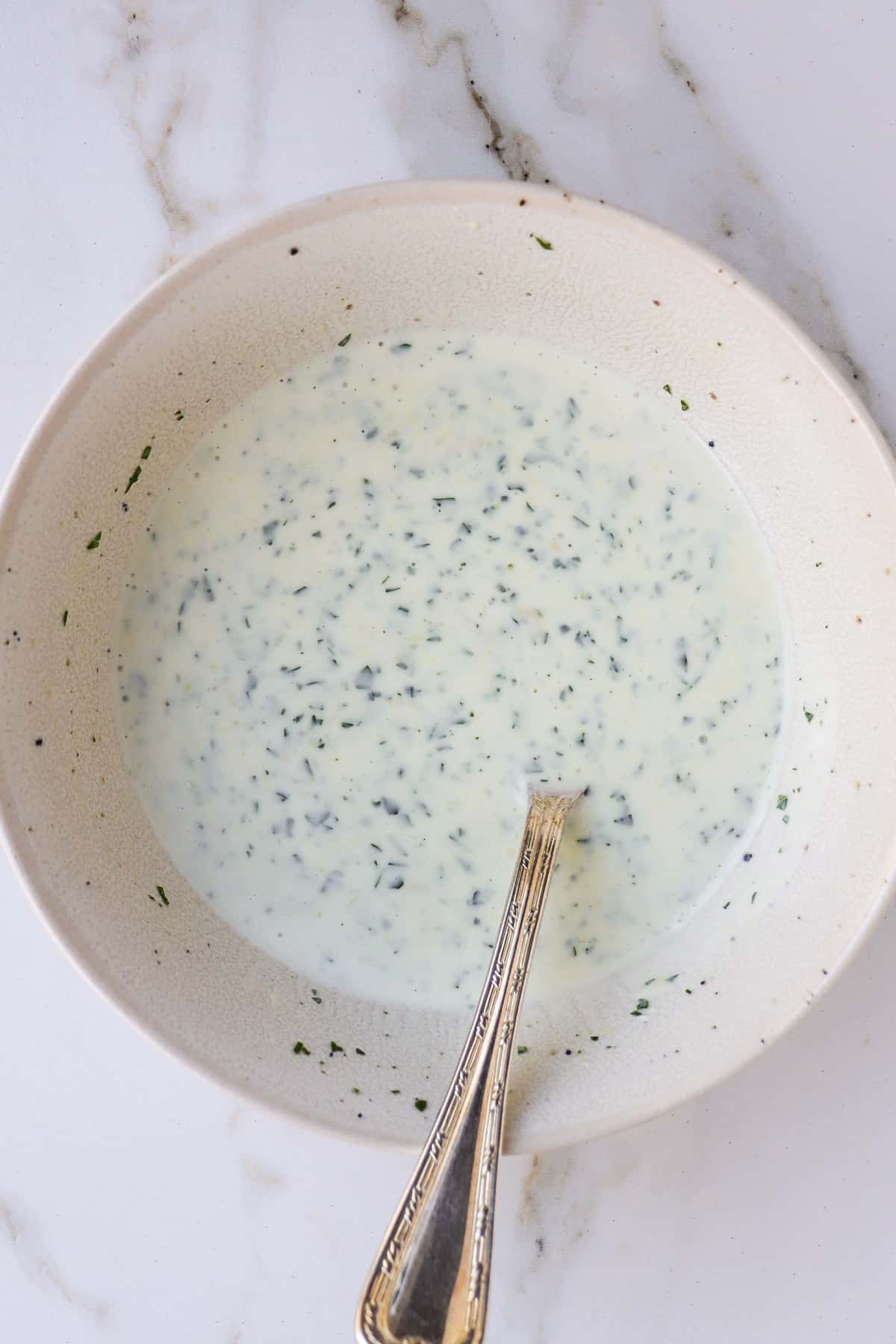 Creamy yoghurt dressing in a bowl.