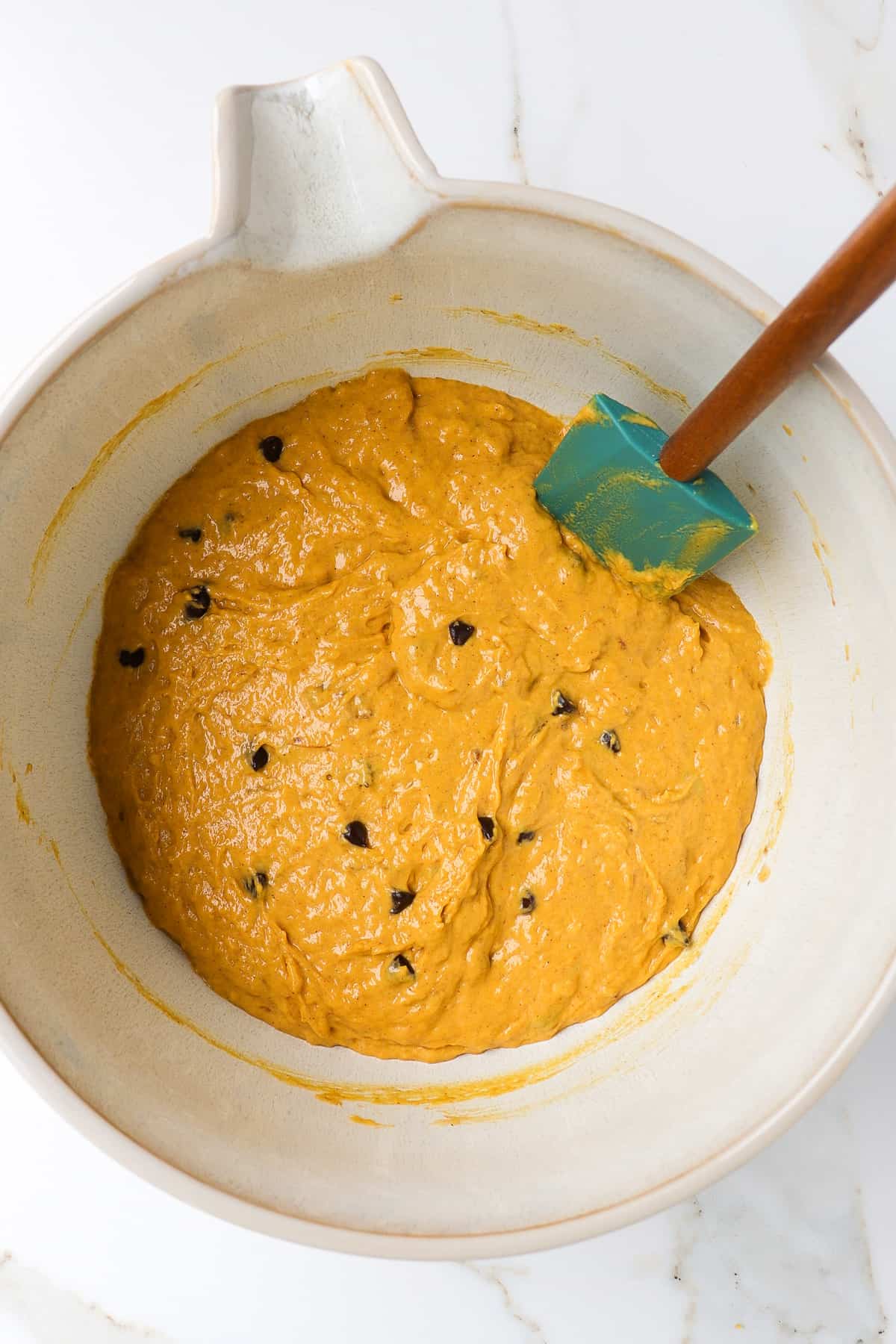 Pumpkin Chocolate chip banana bread batter in a mixing bowl.