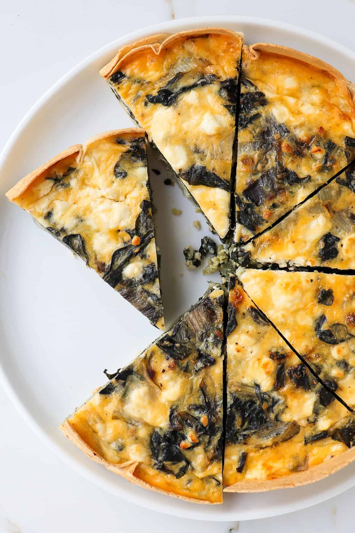 Close up shot of silverbeet quiche.