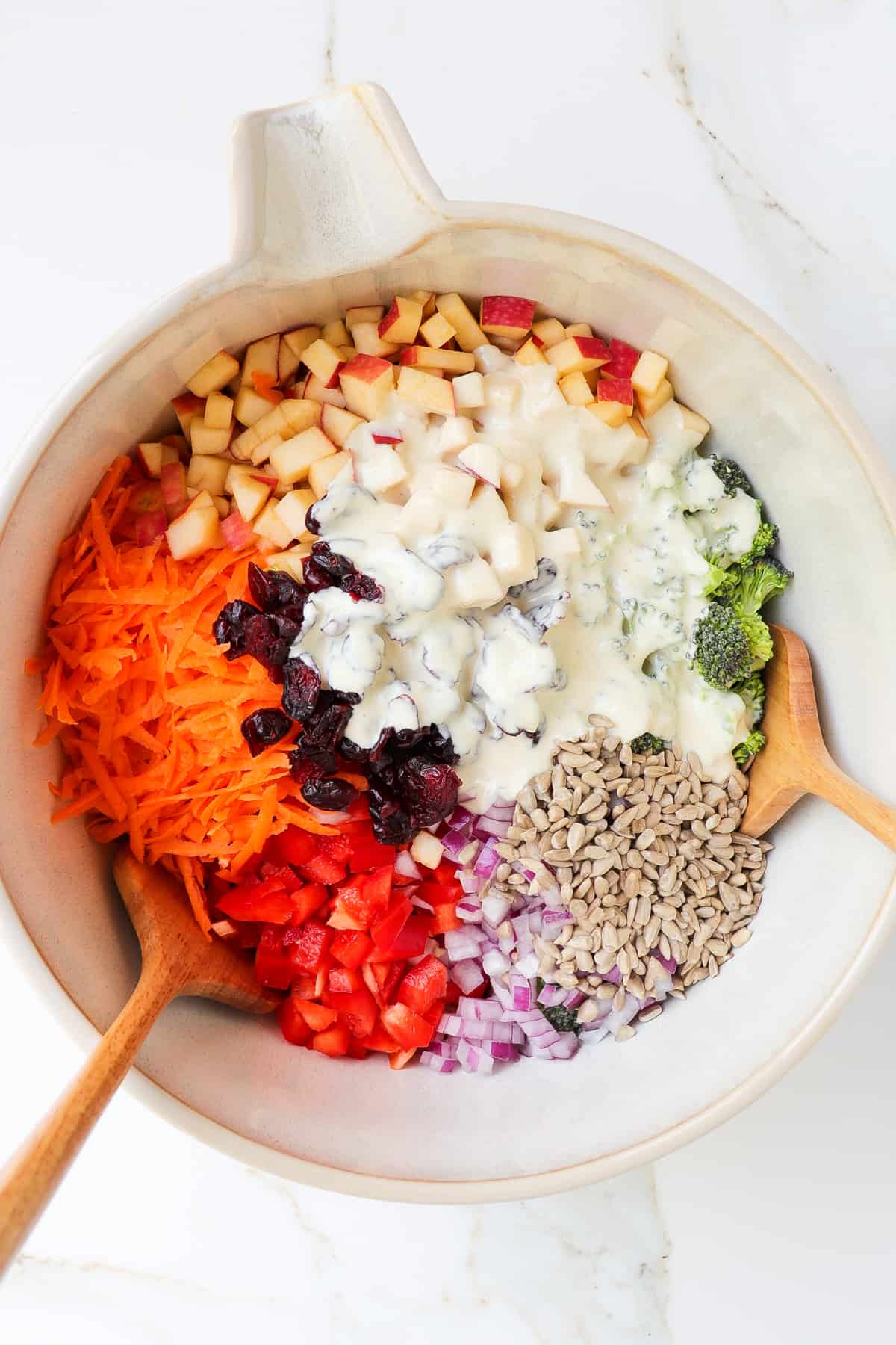 Salad ingredients in a bowl with the dressing poured over.