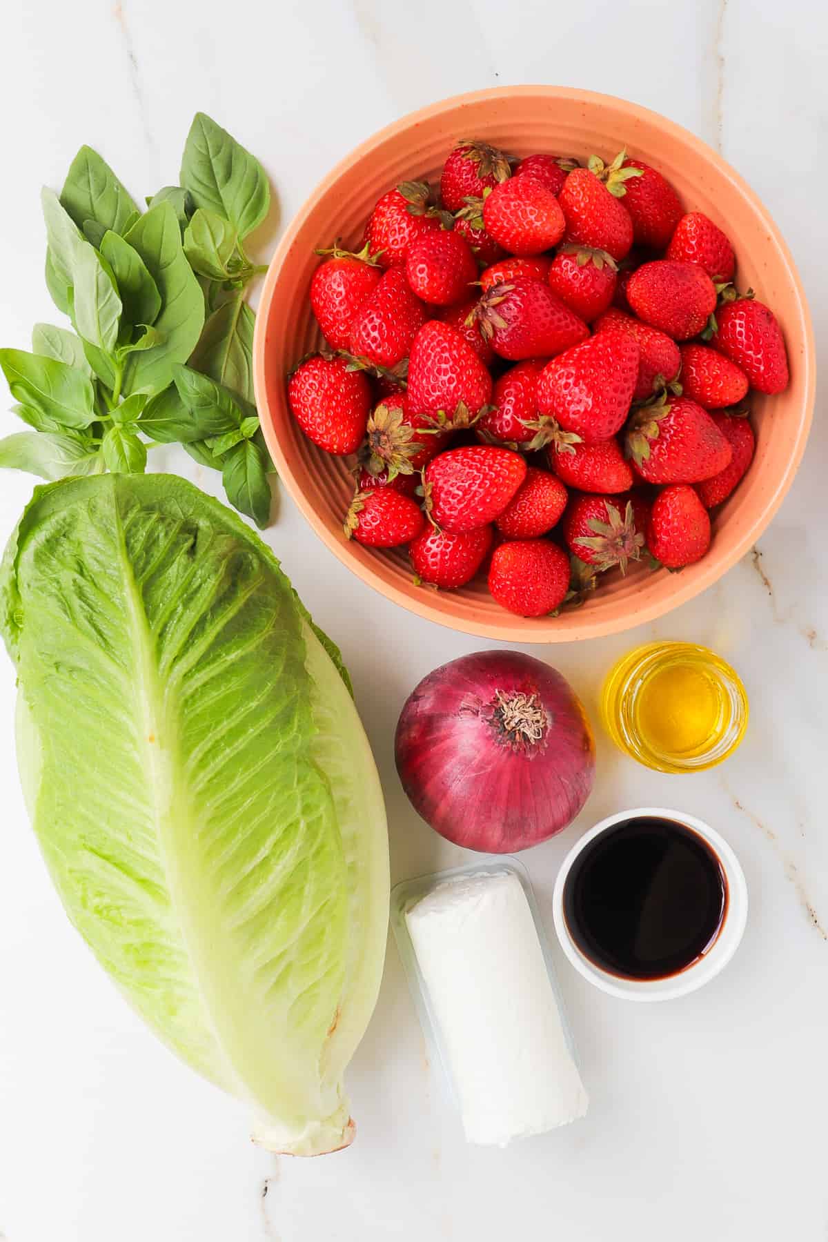 Ingredients shown to make the strawberry goat cheese salad.