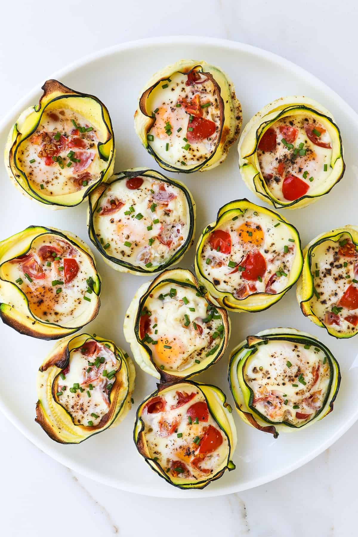 Zucchini egg cups on a plate.