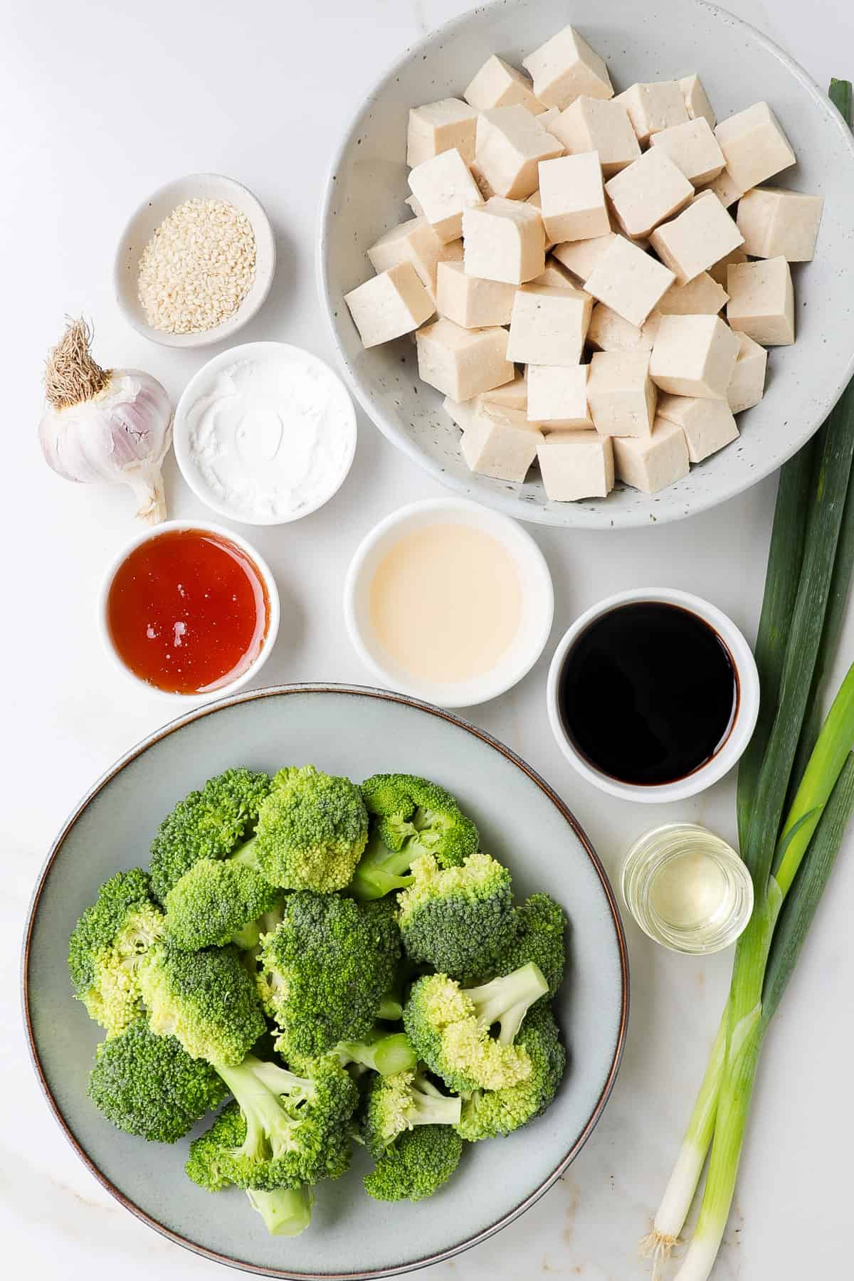 Ingredients shown to make honey garlic tofu and broccoli.