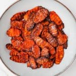 Air fryer carrot chips in a bowl.
