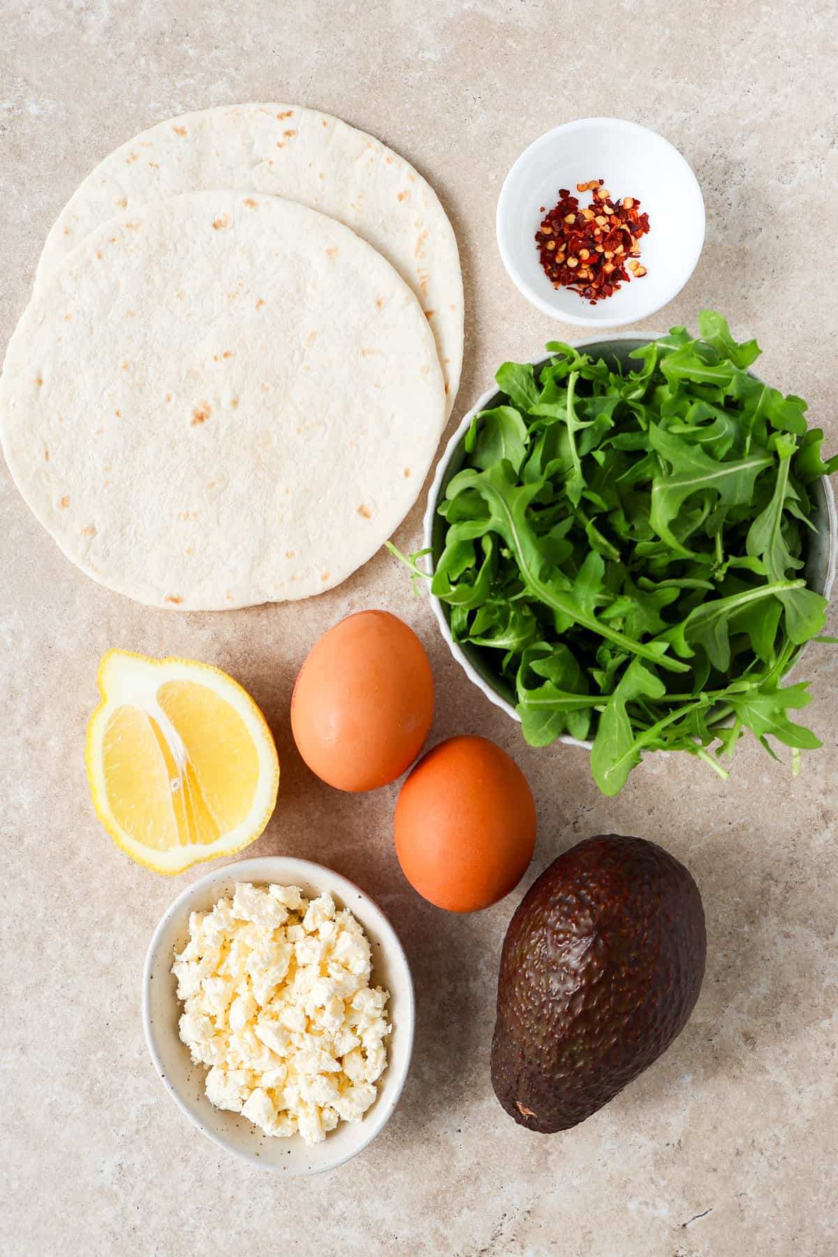 Ingredients shown to make the crispy feta fried egg tortilla.