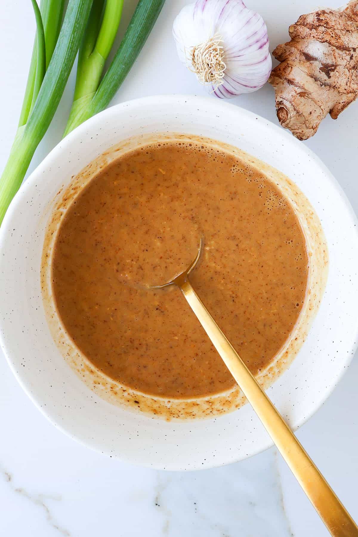Almond butter dressing in a bowl.