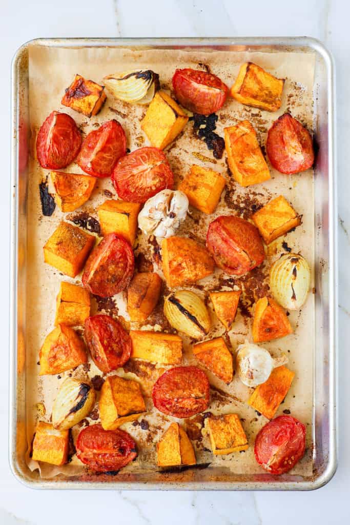 Roasted vegetables ona a sheet pan.
