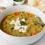Side shot of the soup in a bowl with a spoon.