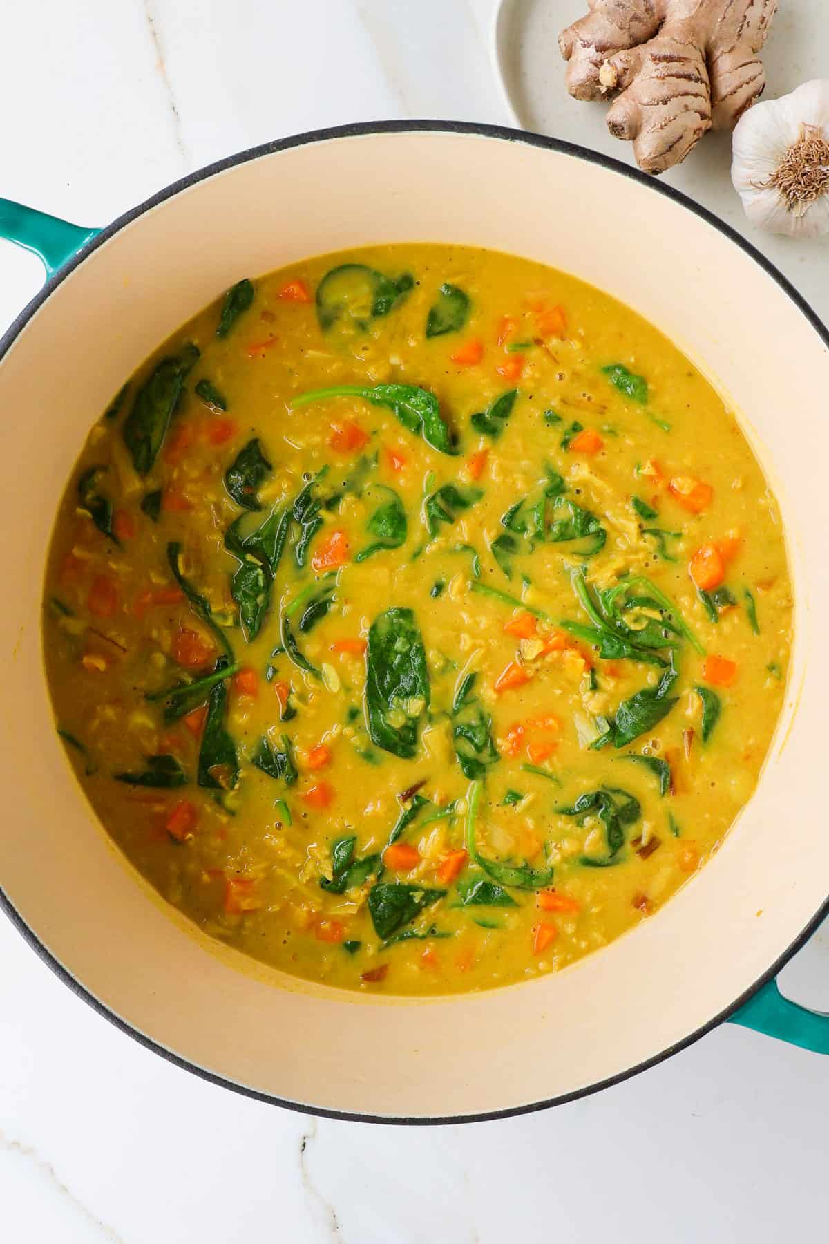 Carrot and lentil soup in a large pot.