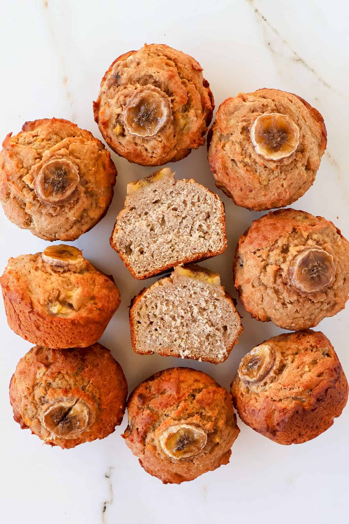 Buckwheat banana muffins with one cut in half.