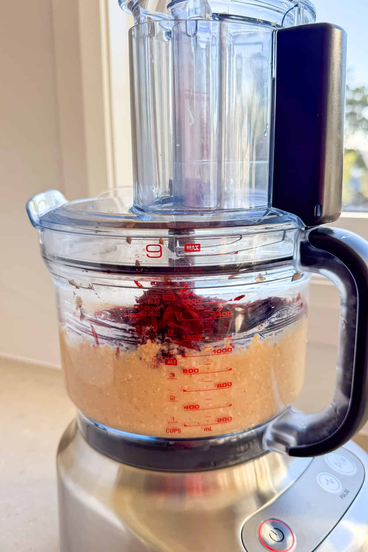 Grated beetroot added to the food processor.