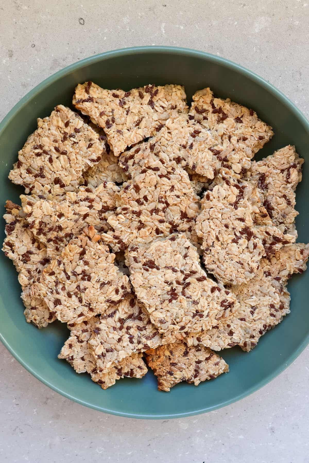 Sunflower seed crackers in a bowl.