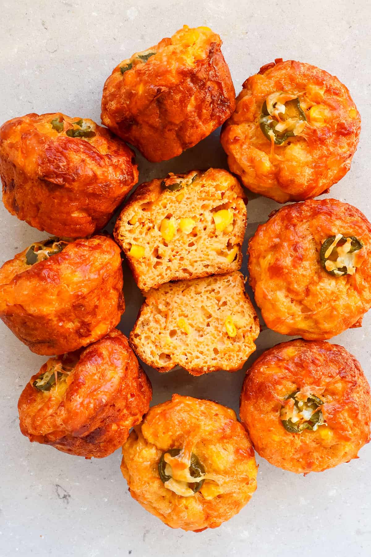 Top view of muffins and one cut in half.