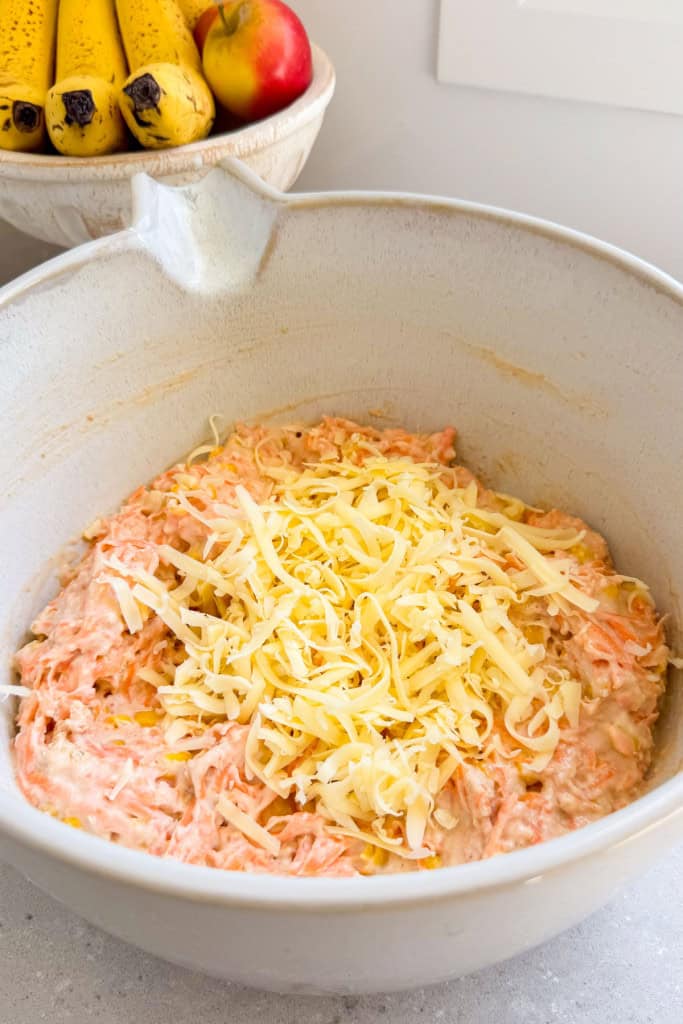 Cheese added to the bowl.