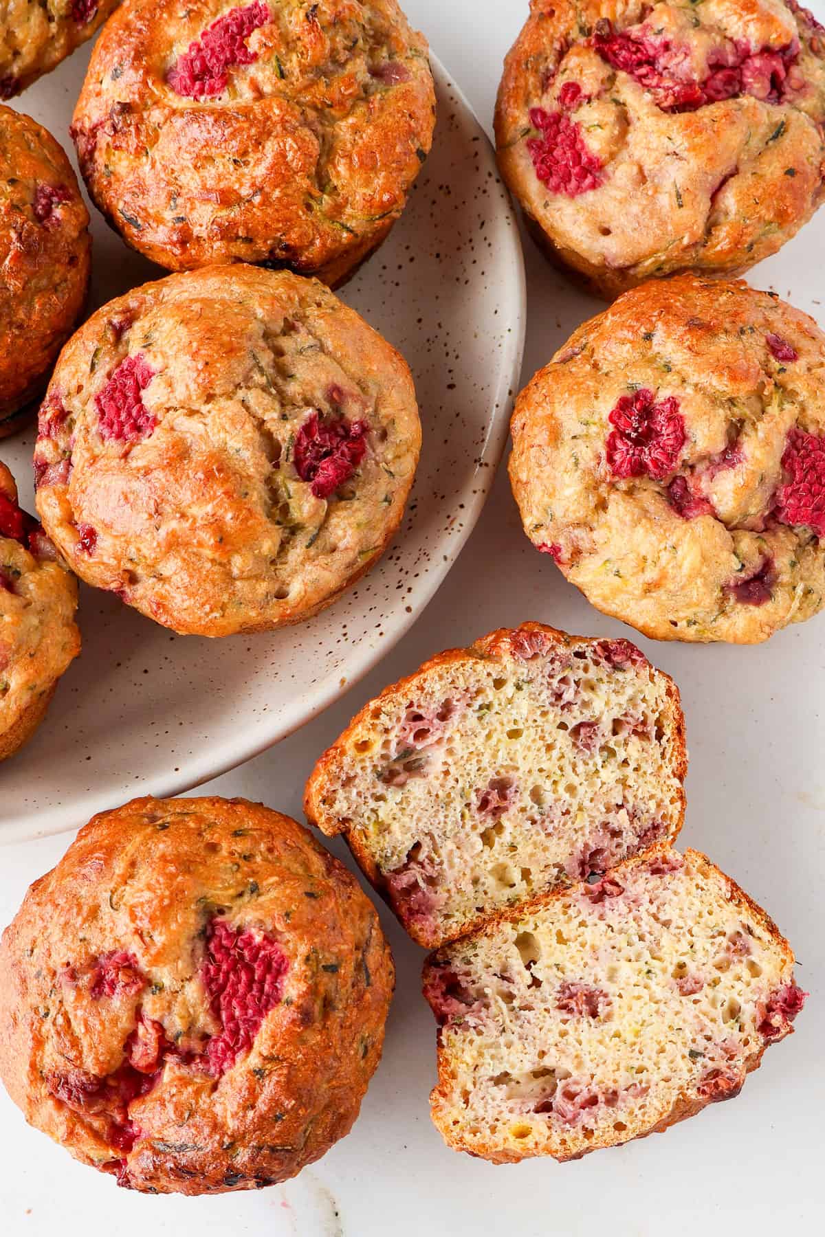 Inside shot of one banana raspberry muffin cut in half.