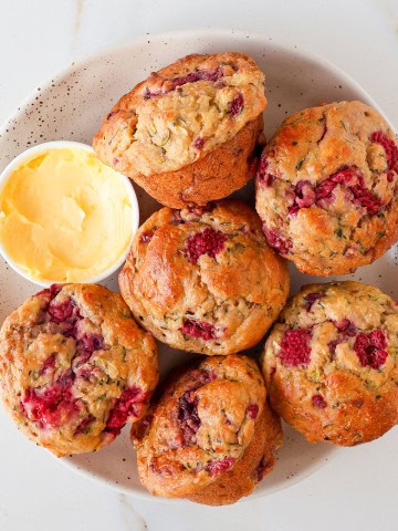 Raspberry and banana muffins on a plate