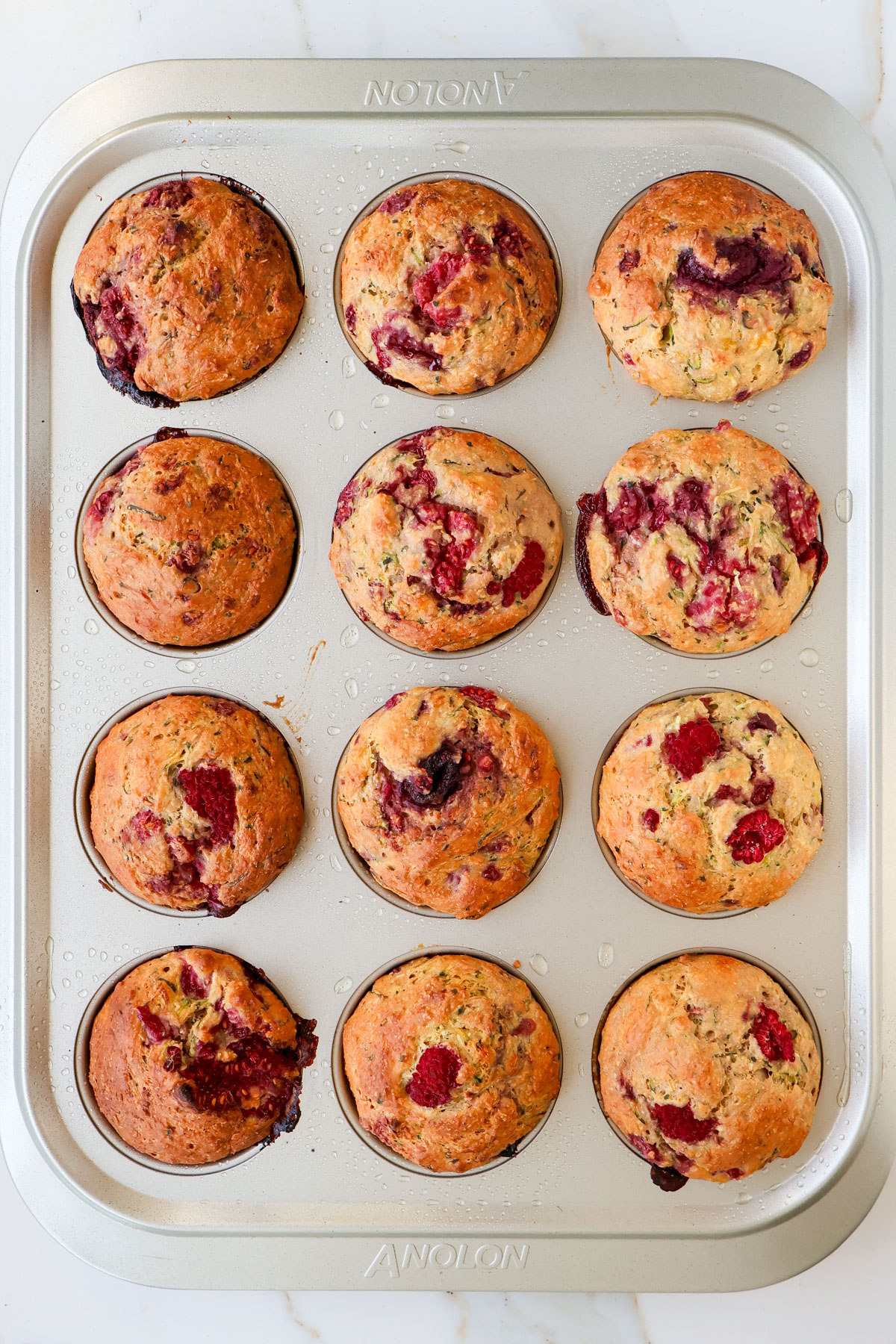 Baked muffins in pan.