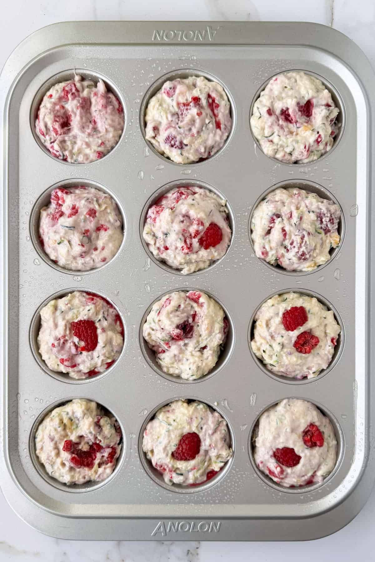 Batter added to muffin pan.