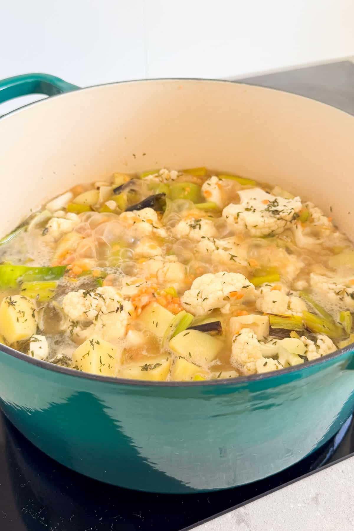 Soup being simmered in a pot.