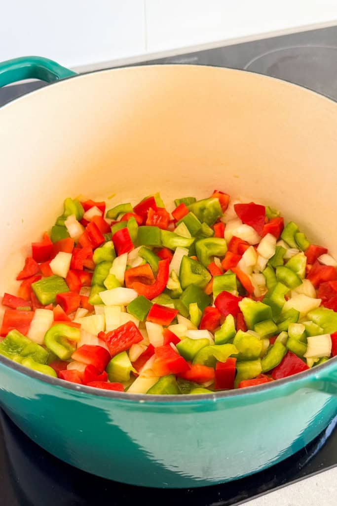 Onions and peppers being sautéed.