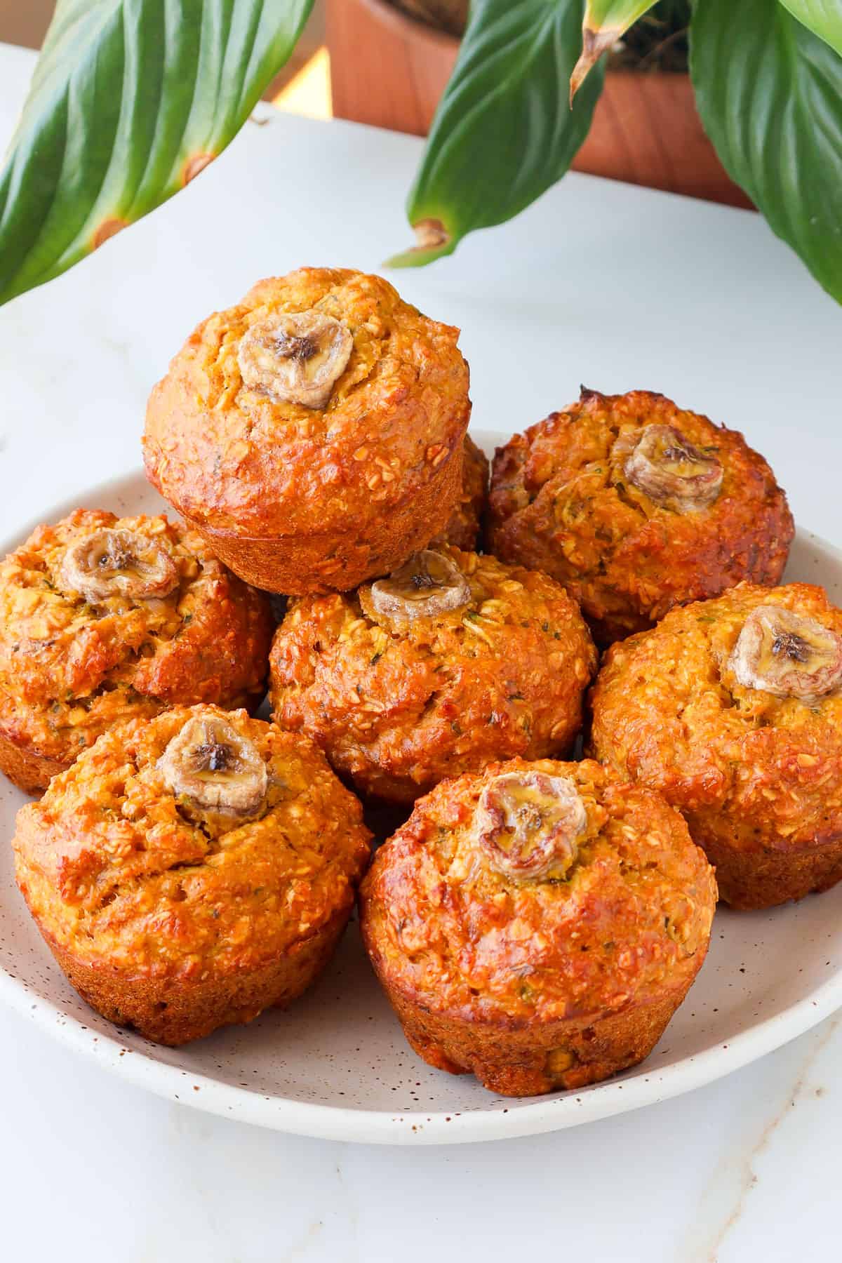 Side shot of muffins on a plate.