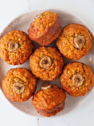 Pumpkin and banana muffins on a plate.