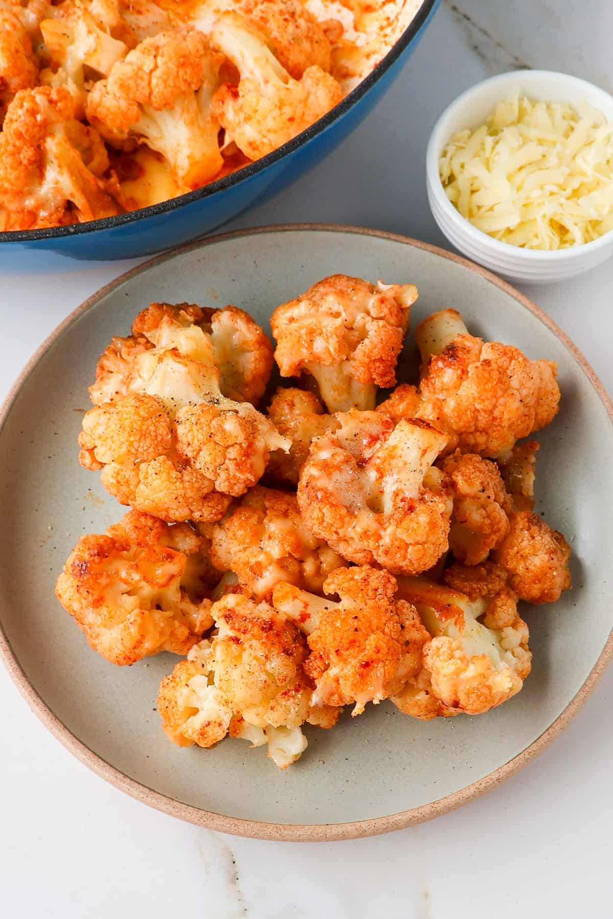 Side shot of sautéed cauliflower on a plate.