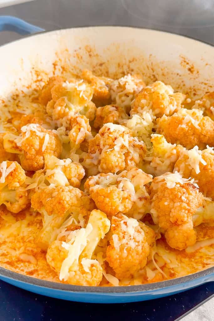 Cheese added on top of the cauliflower.