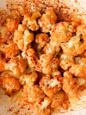 Close up of the cheesy cauliflower in a pan.