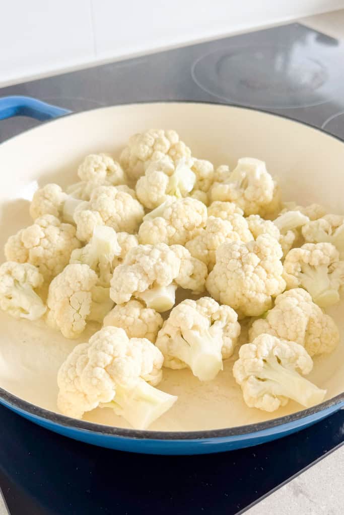 Cauliflower in a pan with water.
