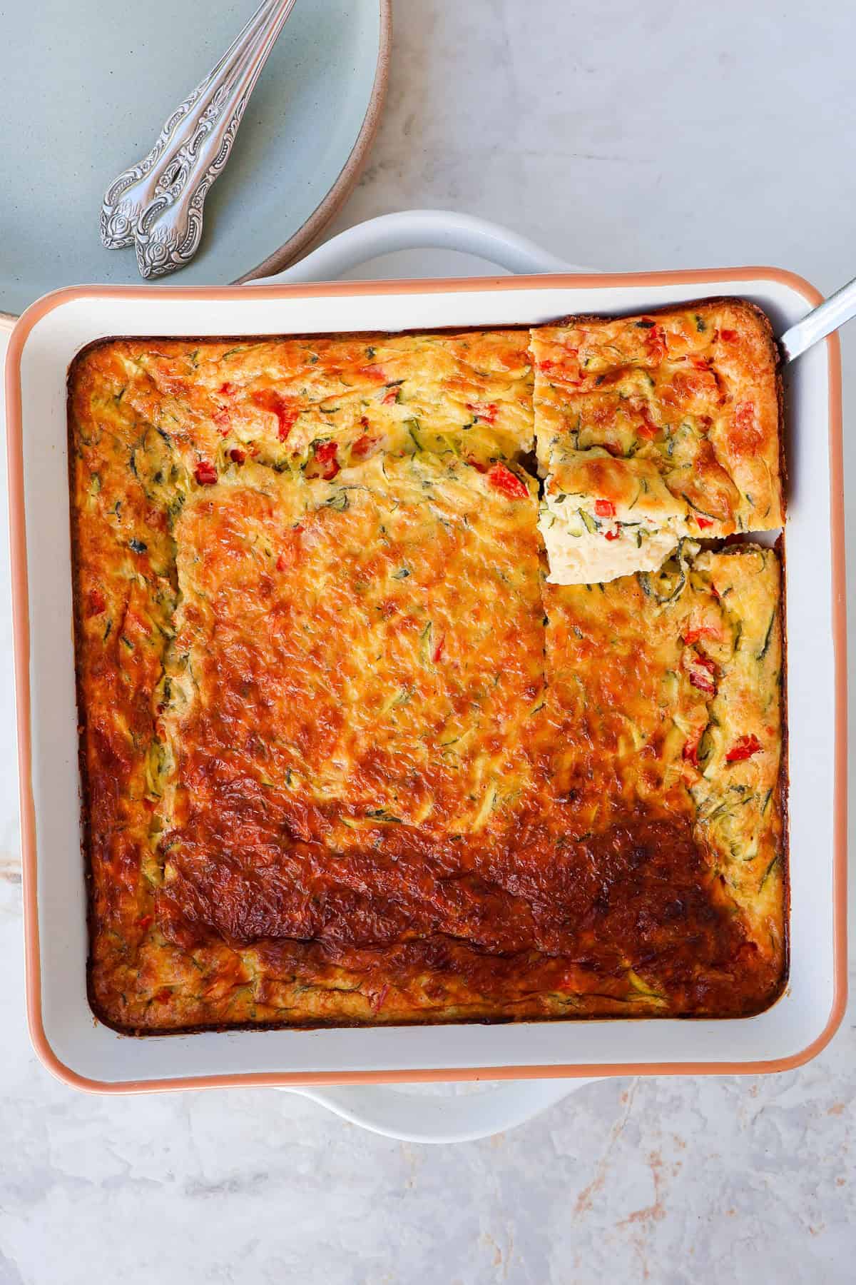 Egg casserole with a square cut out.