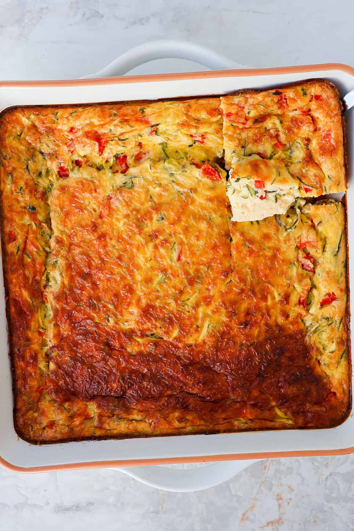 Egg casserole with a square cut out.