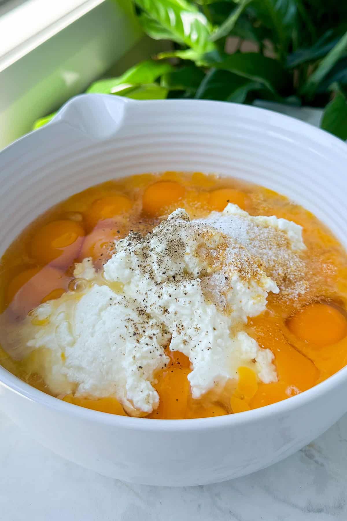 Eggs and cottage cheese in a bowl.