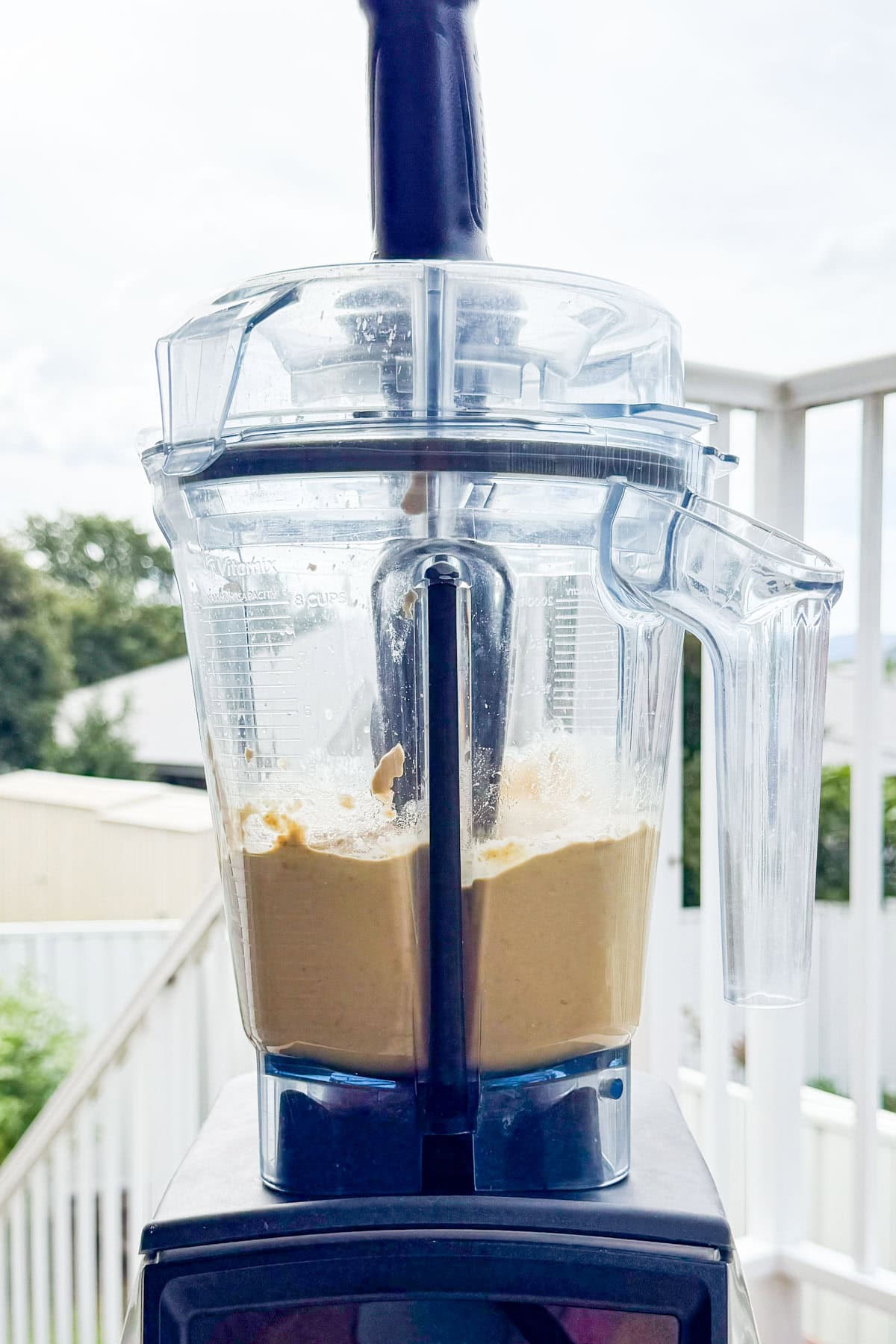 Hummus being blended in a blender.