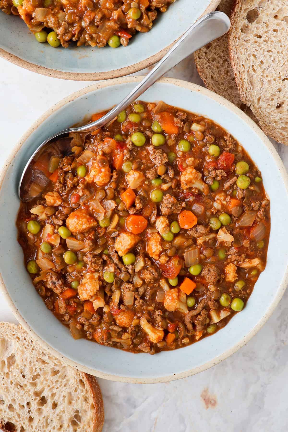 Savoury mince served in a bowl with a spoon.