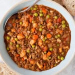 Savoury mince served in a bowl with a spoon.