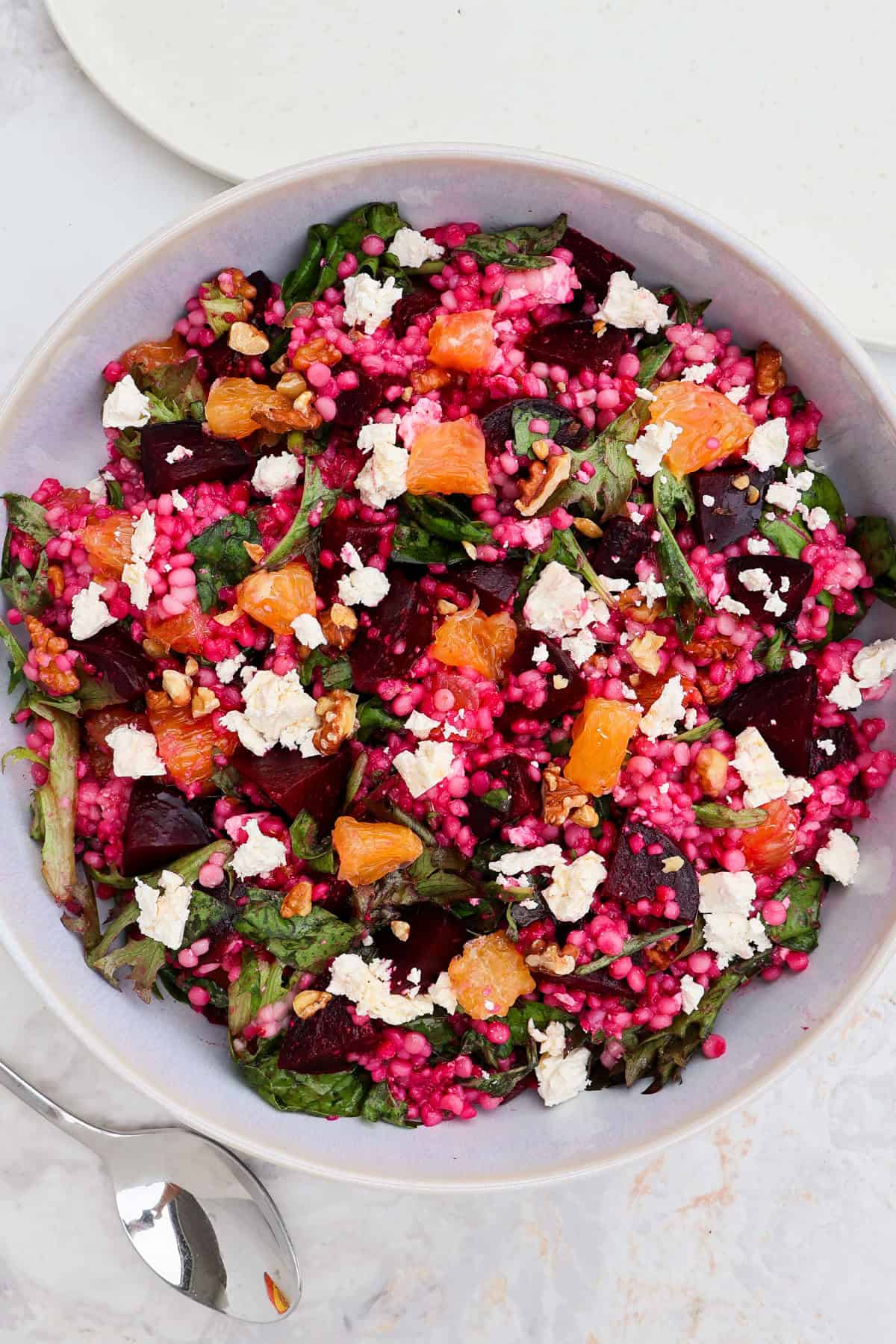 Beetroot couscous salad served in a bowl.
